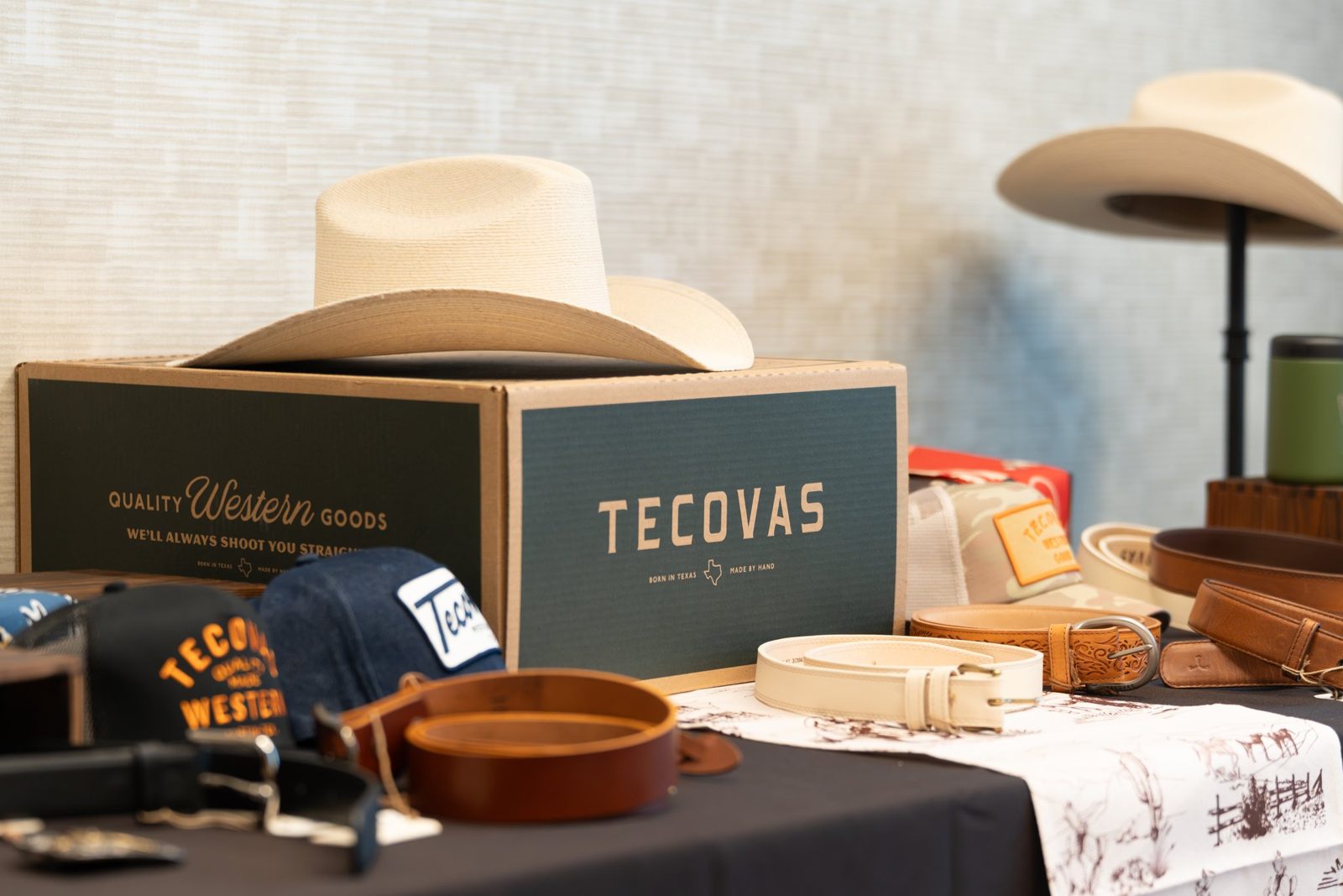 Sponsor Tecovas hats and leather goods on display at the summit